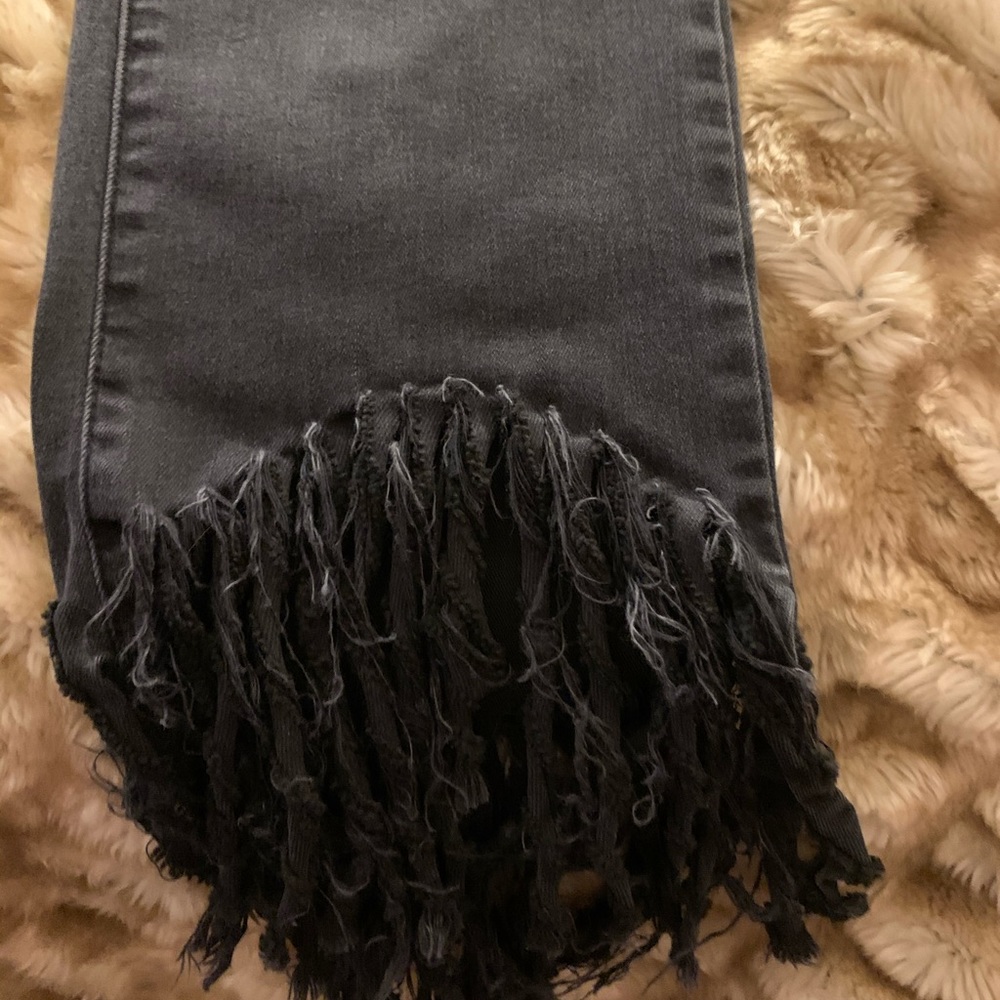 Black denim fringe bottom.
